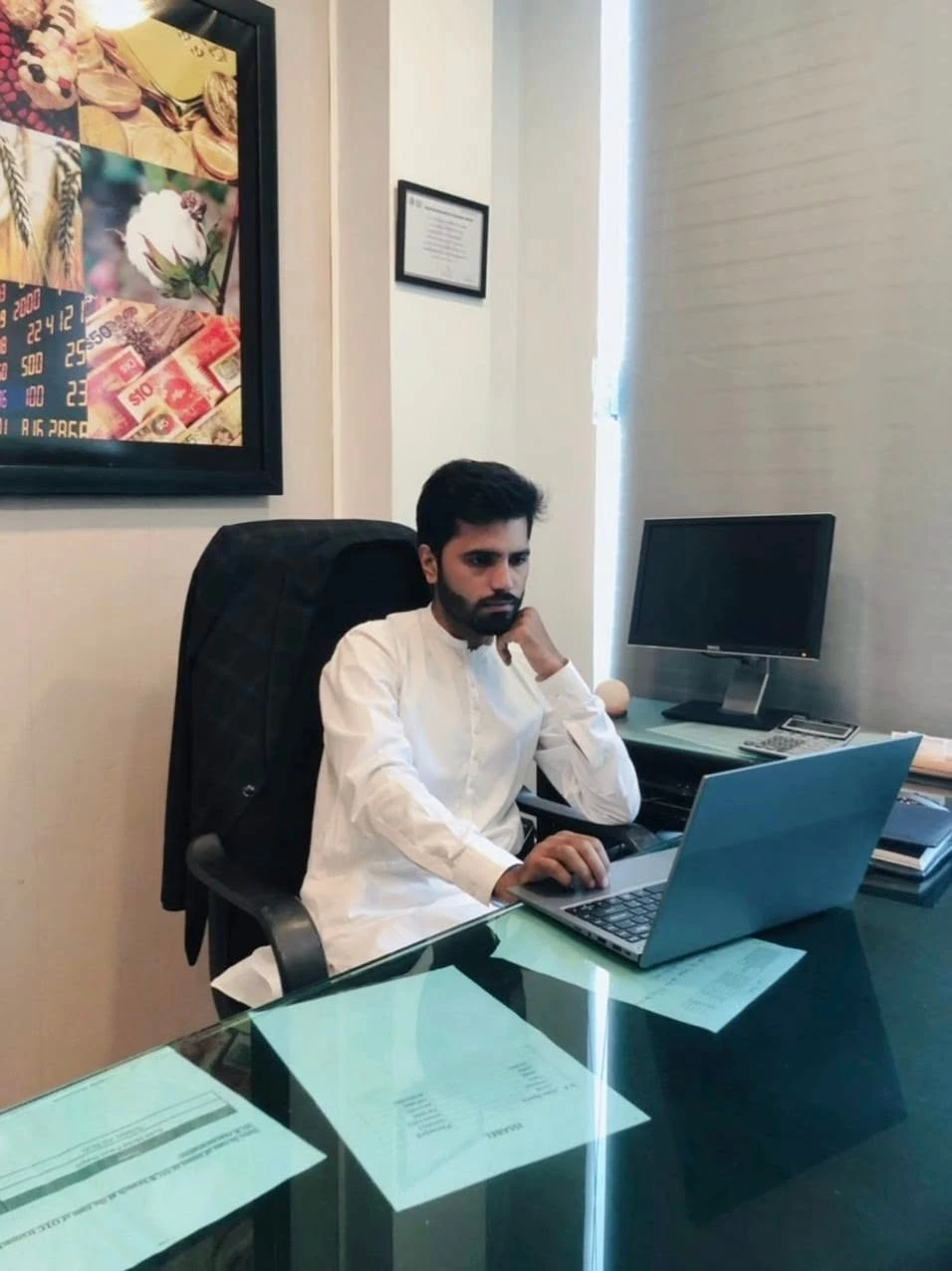 Rabeel Rana working at his desk
